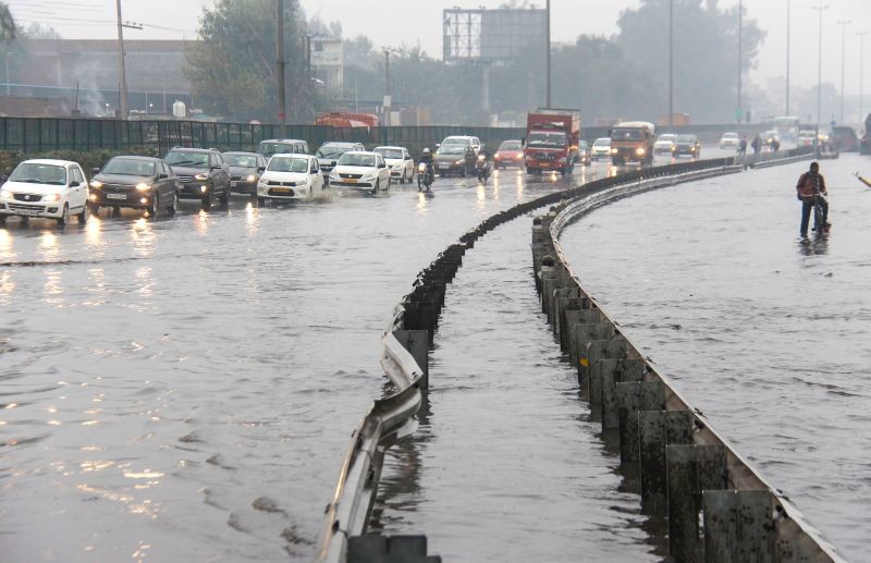 Gurugram: Vehicles move slowly on waterlogged Delhi-Gurugram Expressway after heavy rainfall, in Gurugram, Sunday, Jan. 3, 2021. (PTI Photo)            